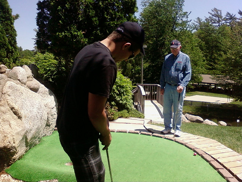 Tommy and Grandpa mini-golfing
